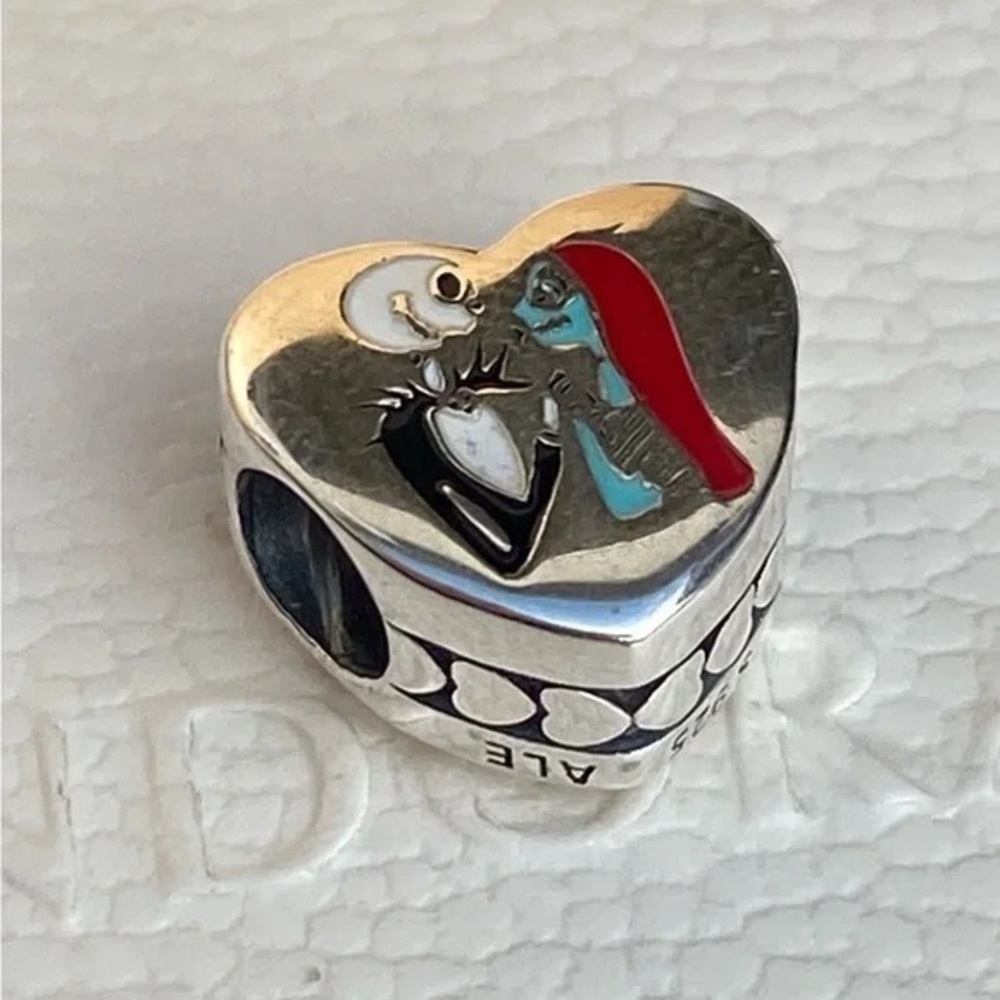 Heart-Shaped Silver Charm with Red and Blue Accents
